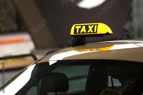taxi sign on an taxi car