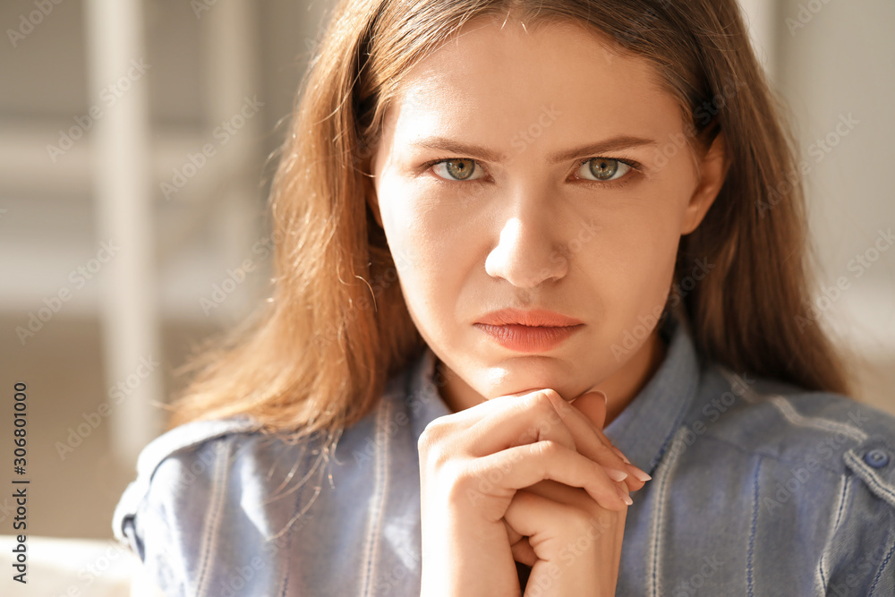 Worried young woman at home Worried young woman at home