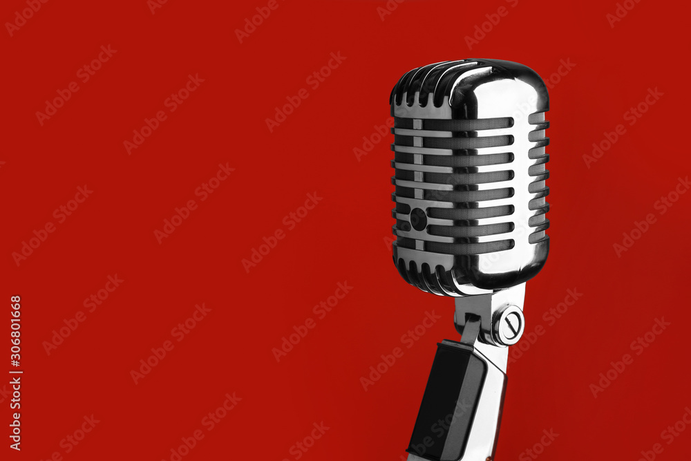 Fototapeta premium Retro microphone on color background