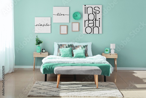 Stylish interior of bedroom in turquoise color photo
