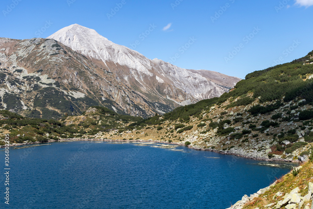 Fish Banderitsa lake and Vihren Peak, Pirin Mountain, Bulgaria Fish Banderitsa lake and Vihren Peak, Pirin Mountain, Bulgaria