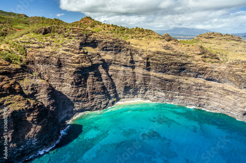 aerial view of the Kauai Coastline with turquoise water and sea cliffs