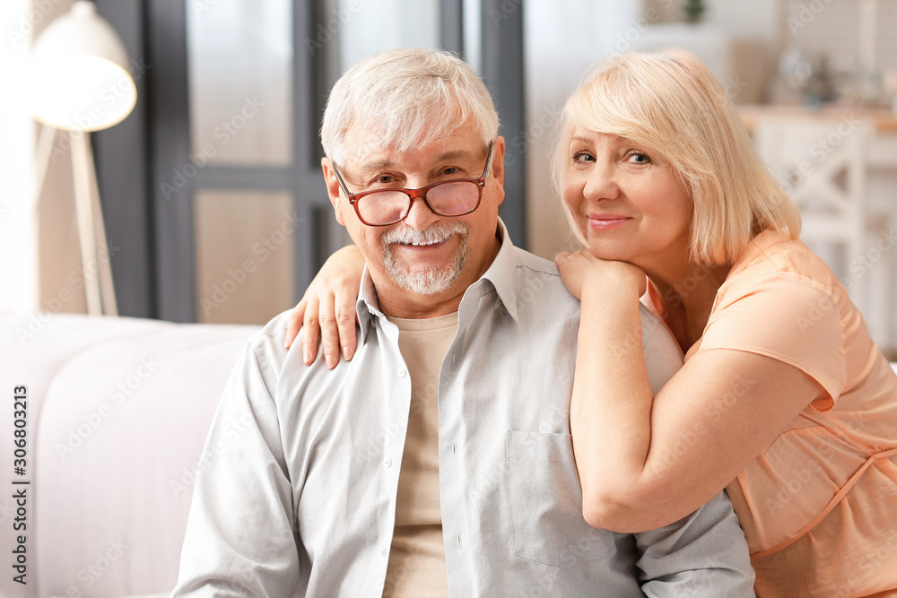 Happy mature couple resting together at home Happy mature couple resting together at home