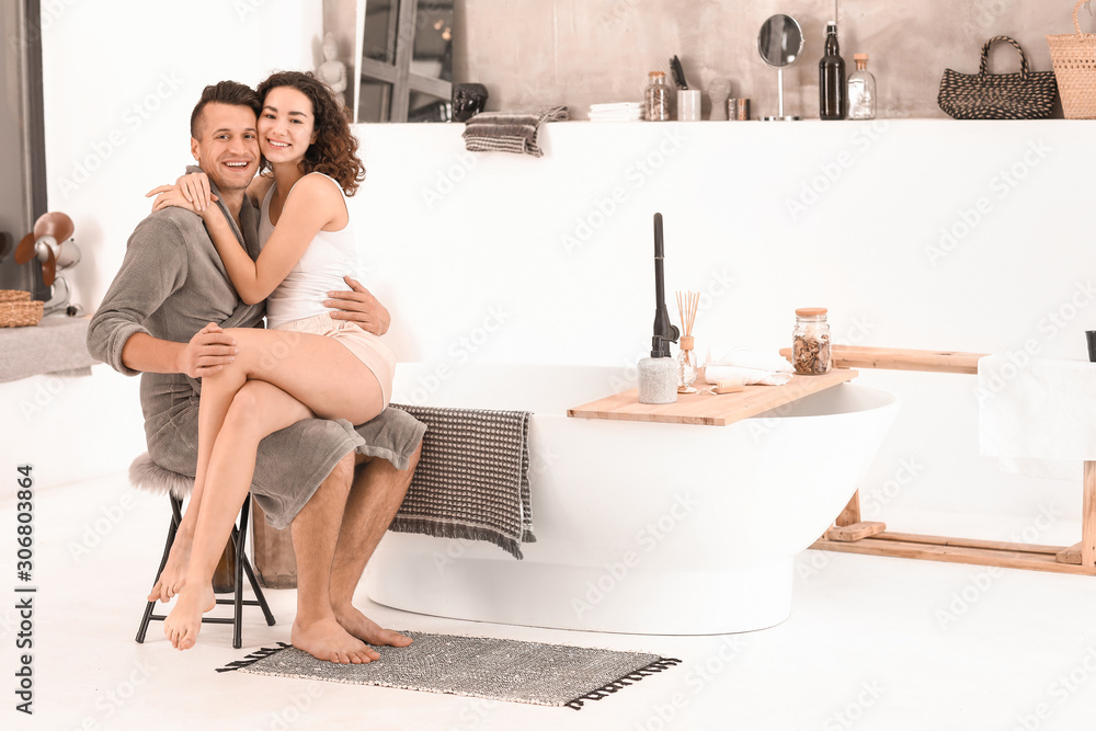 Happy young couple in bathroom at home Happy young couple in bathroom at home