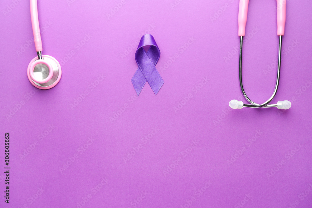 Fototapeta premium Stethoscope and purple ribbon as symbol of World Cancer Day on color background
