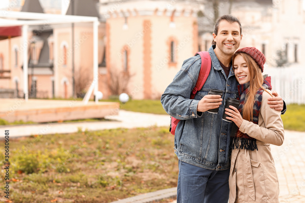 Happy couple walking in autumn city Happy couple walking in autumn city