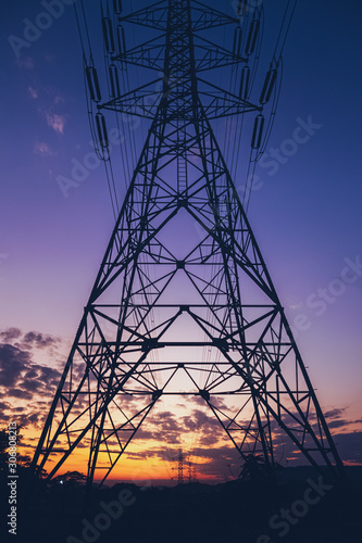 Hight voltage electric towers or pole at sunset