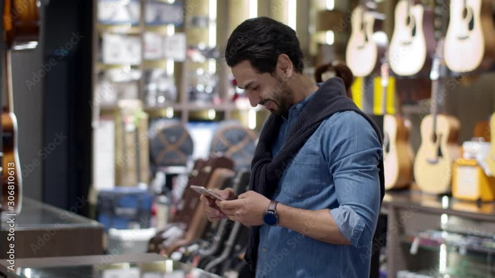 Young man paying with QR code by smartphone contactless Young man paying with QR code by smartphone contactless
