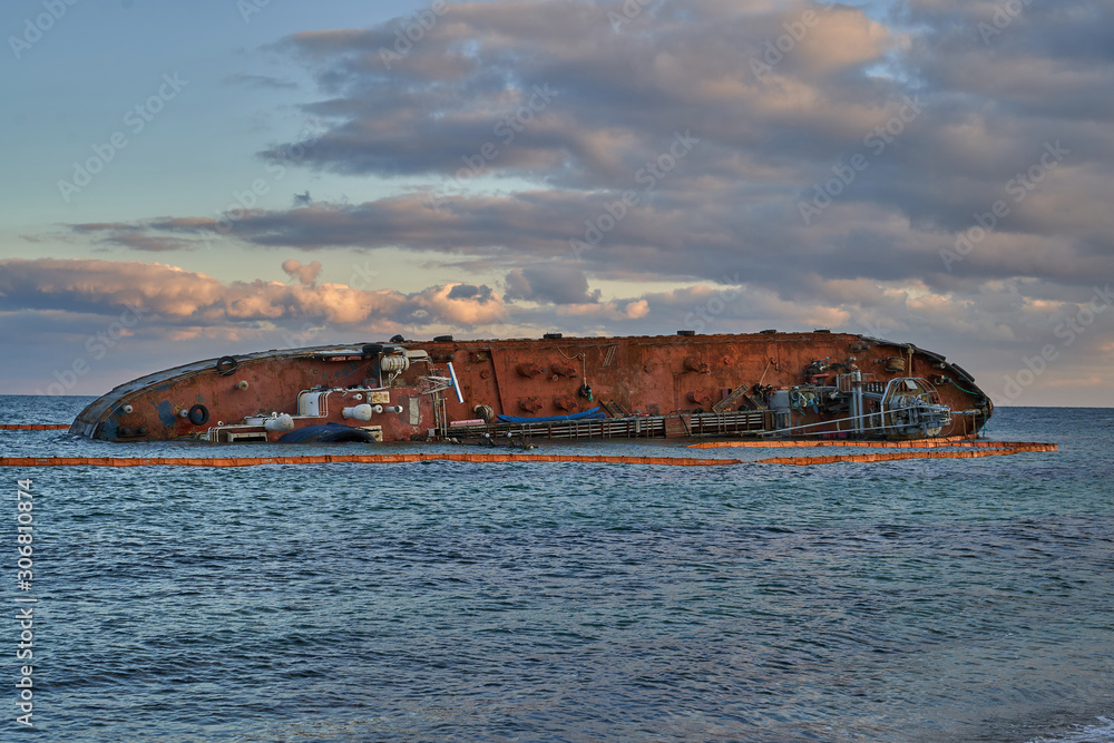 sunken tanker. Tanker Bunker threw storm ashore. The tanker lies on its side. Accident with tanker