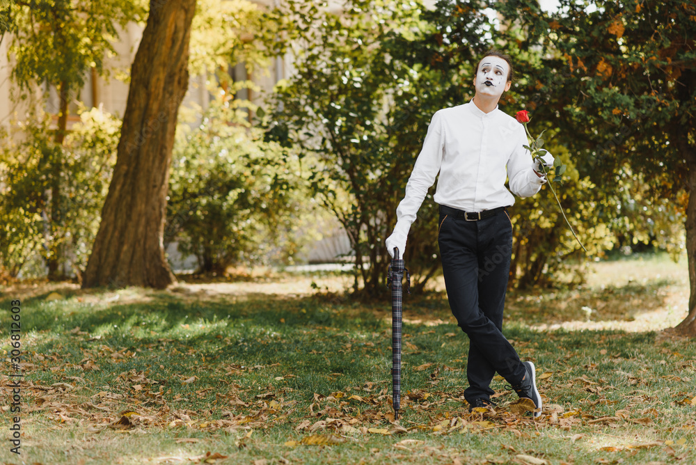 young Funny mime shows something. young Funny mime shows something.