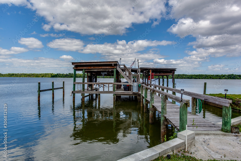 Long boat dock with boat lift at the end