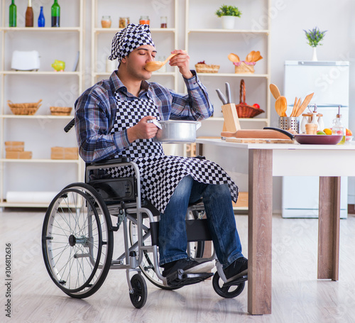 Disabled man preparing soup at kitchen © Elnur