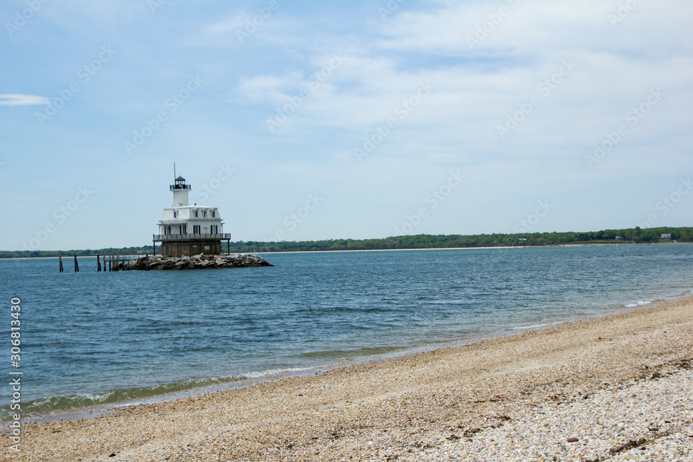 Small Lighthouse in Blue Atlantic at Orient Point in Long Island