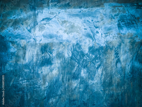 Abstract grunge grainy blue concrete wall texture background, blurred unfocused image