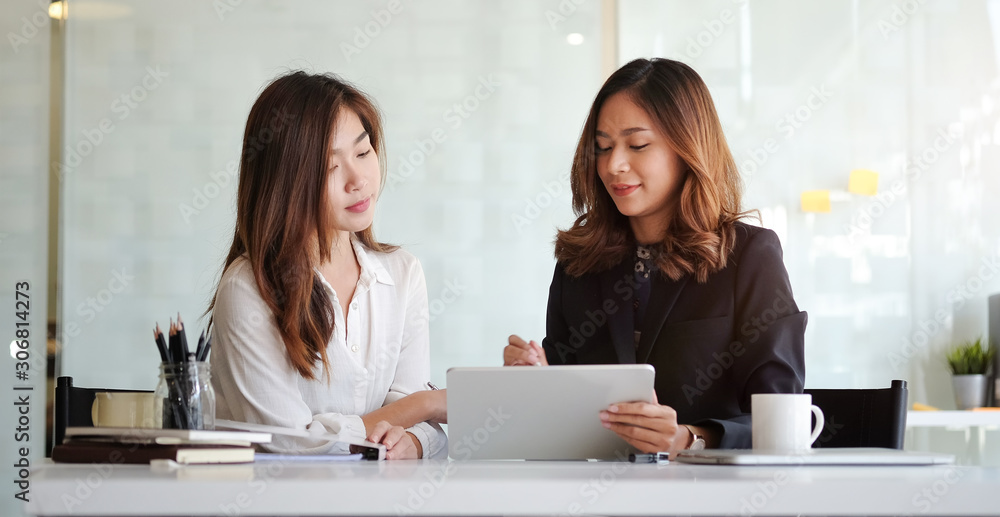 Concept business woman working and people happy businesswoman or creative female office worker with computers writing to notebook with documents and laptop. Concept business woman working and people happy businesswoman or creative female office worker with computers writing to notebook with documents and laptop.