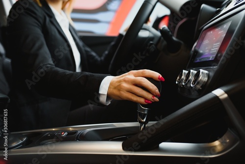 Young business woman driving in her car to work. Successful business concept. business woman driving © Serhii