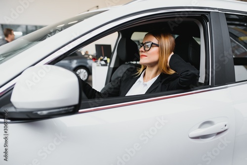 Young business woman driving in her car to work. Successful business concept. business woman driving