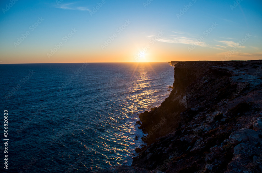 Sunset from the cliff, clear blue sky with sunset, silhouette of the cliff in the front (Western Australia, Australia, 2019)