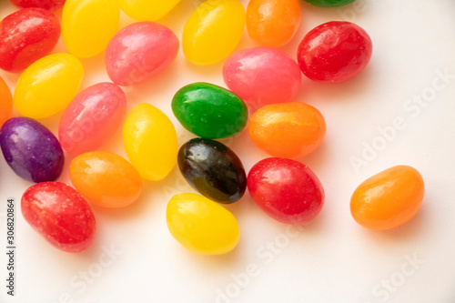 Isolated Jelly Bean Close Up Colorful candy used for decorating cookies, treats and gingerbread houses. Easter treat. Macro view. White background. Fun and sweet.