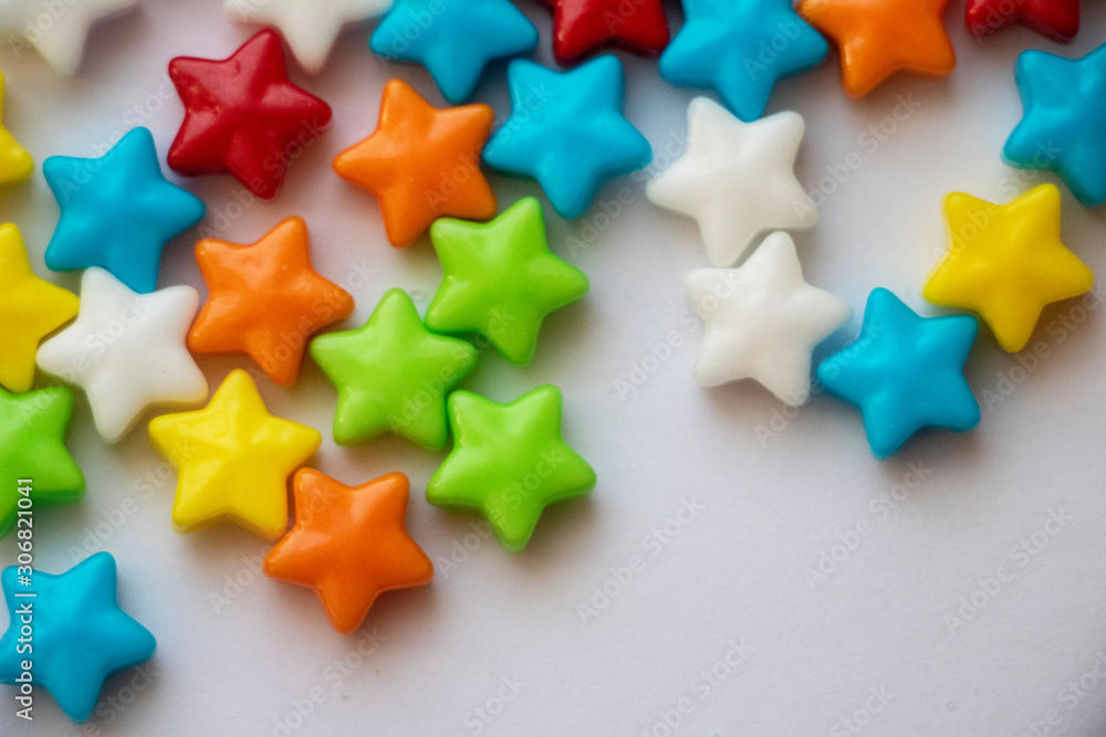 Isolated Candy Stars Close Up Colorful candy stars used for decorating cookies, treats and gingerbread houses. Macro view. White background. Fun and sweet. Isolated Candy Stars Close Up Colorful candy stars used for decorating cookies, treats and gingerbread houses. Macro view. White background. Fun and sweet.