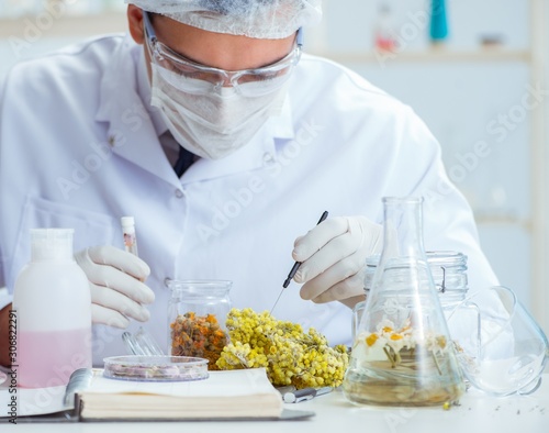 Chemist mixing perfumes in the lab