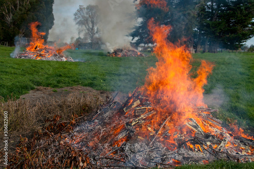 Multiple burn piles getting rid of the rubbish and garden cuttings on the paddock at the farm