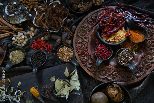 A variety spices and herbs in wooden bowls, Of Asians For cooking.