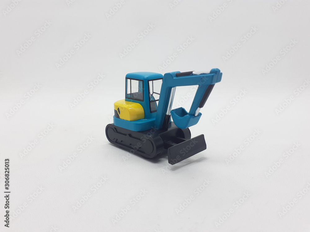 Obraz premium Photo Realistic Heavy Machinery Tractor Excavator Miniature Die Cast Toys Design for Souvenir Gift Collection Items in White Isolated Background