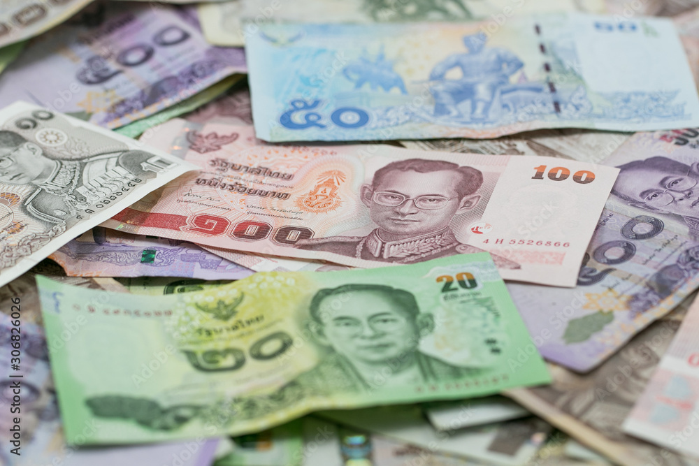 Thai money - Baht.Thai money - Baht.Pile of various currencies isolated on white background.Thai baht banknote coin isolated on white background.Many of Thai Baht background.Thai currency. Thai money - Baht.Thai money - Baht.Pile of various currencies isolated on white background.Thai baht banknote coin isolated on white background.Many of Thai Baht background.Thai currency.