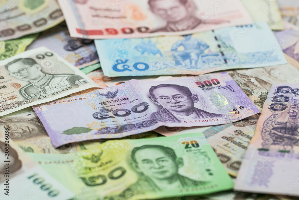 Thai money - Baht.Thai money - Baht.Pile of various currencies isolated on white background.Thai baht banknote coin isolated on white background.Many of Thai Baht background.Thai currency. Thai money - Baht.Thai money - Baht.Pile of various currencies isolated on white background.Thai baht banknote coin isolated on white background.Many of Thai Baht background.Thai currency.
