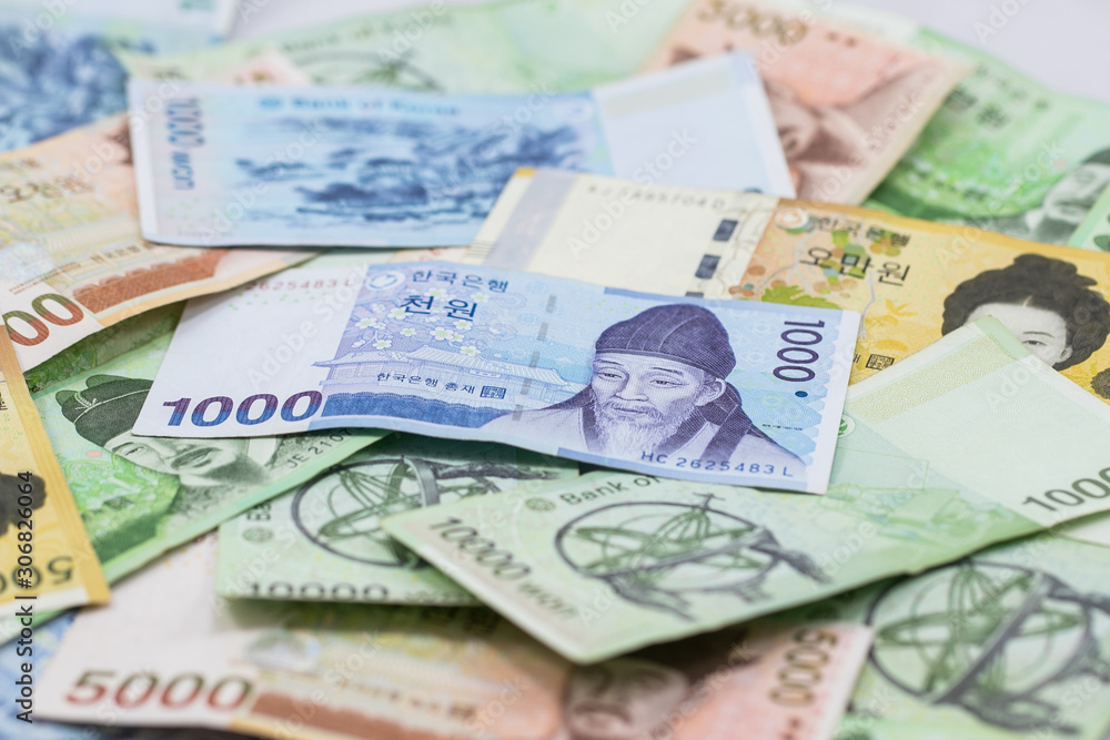 Korean currency.Pile of various currencies isolated on white background.South Korean Won Currency. Korean currency.Pile of various currencies isolated on white background.South Korean Won Currency.