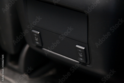 Control switch heated two rear seats on the car dashboard with plastic buttons to control the temperature of the passenger compartment and comfort while driving. Auto service industry.