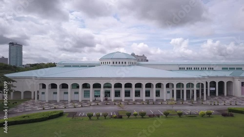Kuching, Sarawak / Malaysia - December 1 2019: The Sarawak State Library, lake, gardens and surrounding lush scenery photo