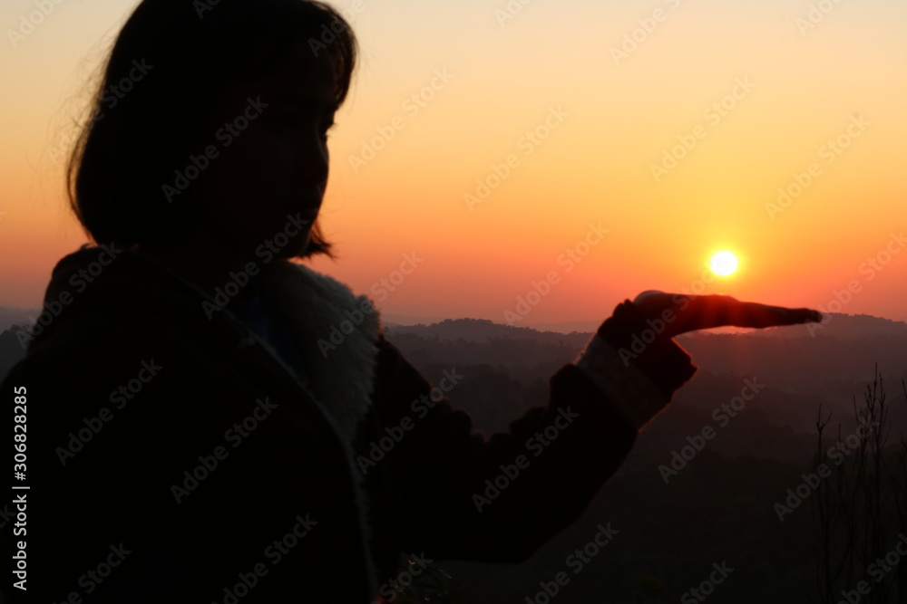 silhouette of girl with sunrise