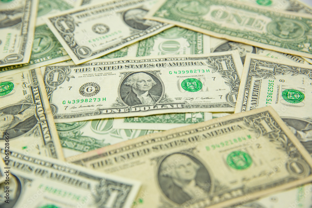 Money american hundred dollar bills Pile of various currencies isolated on white background.Closeup of assorted American banknotes.US currency scattered on the table.america currency dollor currency.