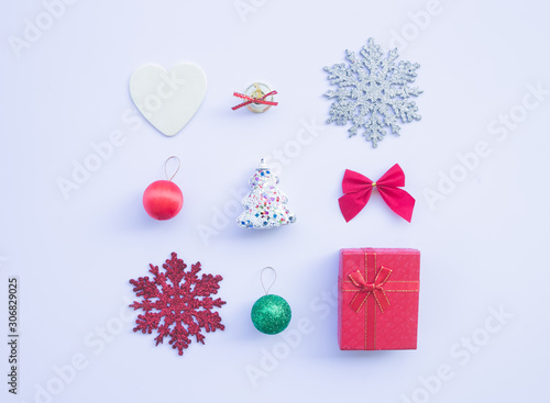 Christmas composition. Gifts  fir tree branches  red decorations on white background. top view  copy space