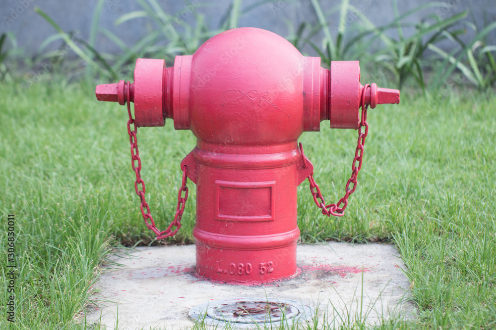 Red fire pump in front of concrete wall. fire safety pump on cement floor of concrete building. Deluge system of firefighting system. Plumbing fire protection. High pressure fire safety pump. Red fire pump in front of concrete wall. fire safety pump on cement floor of concrete building. Deluge system of firefighting system. Plumbing fire protection. High pressure fire safety pump.