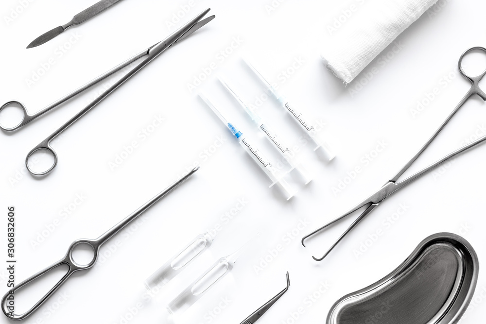 Instruments for plastic surgery on white background top view flat lay pattern Instruments for plastic surgery on white background top view flat lay pattern