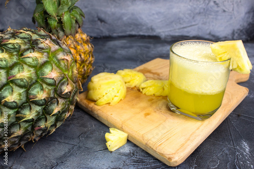 pineapple juice on a gray background