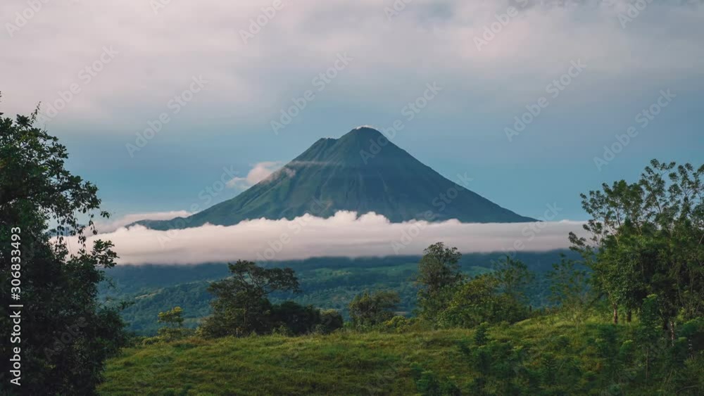Seamless Video Loop / Cinemagraph time-lapse of the impressive Arenal Volcano at La Fortuna, Costa Rica. Little clouds are moving around the peak and volcanic smoke rises from it. Seamless Video Loop / Cinemagraph time-lapse of the impressive Arenal Volcano at La Fortuna, Costa Rica. Little clouds are moving around the peak and volcanic smoke rises from it.