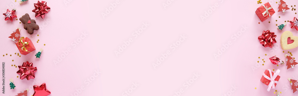 Christmas background with decorations and gift boxes on PINK background
