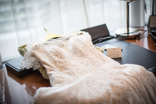Bride dress on the table to use on wedding ceremony day. sign of wedding ceremony.