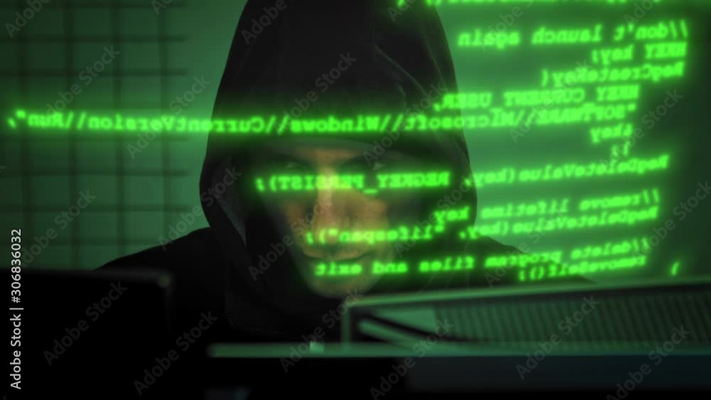 Close-up of male hacker working on a computer for cyber attack while ...