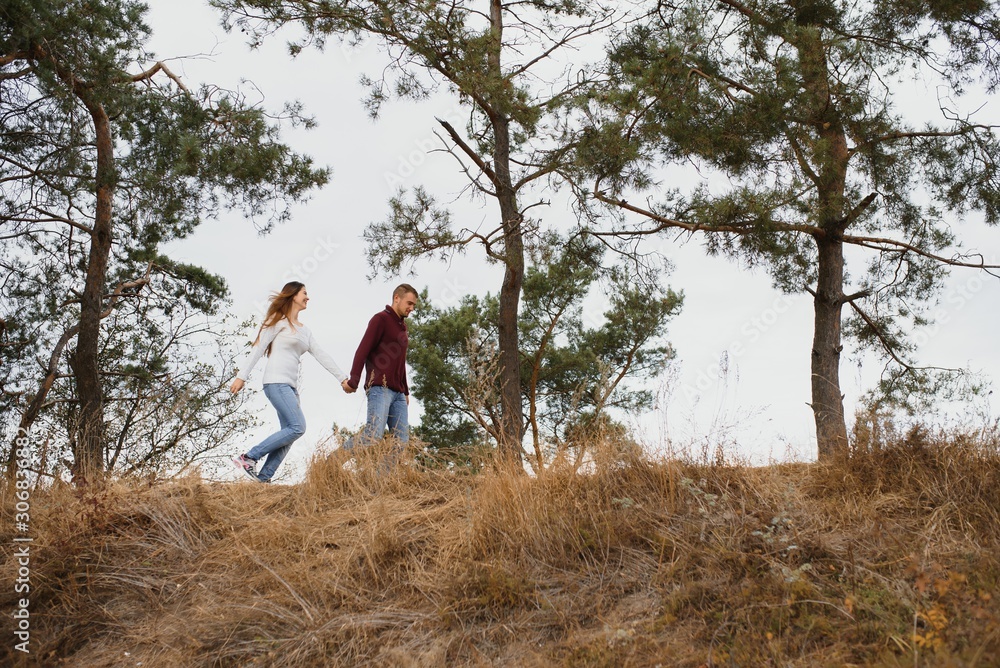Portrait of happy couple in love dating outdoors at the park. Valentine day. Happy relationship Portrait of happy couple in love dating outdoors at the park. Valentine day. Happy relationship
