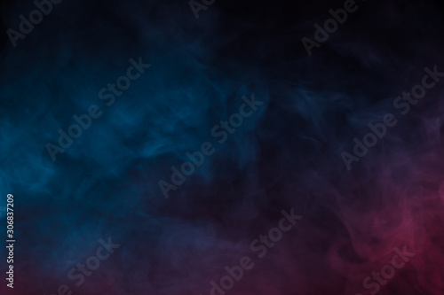 Colorful smoke close-up on a black background photo