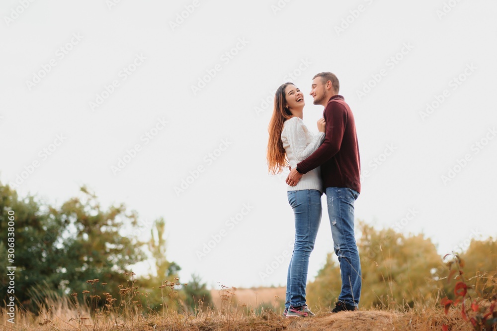 Portrait of happy couple in love dating outdoors at the park. Valentine day. Happy relationship Portrait of happy couple in love dating outdoors at the park. Valentine day. Happy relationship