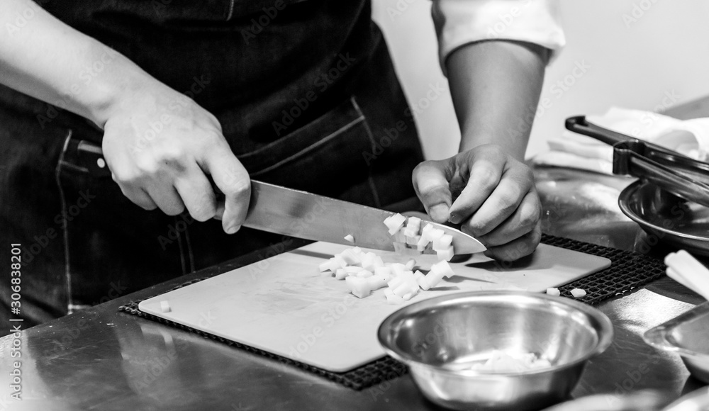 Chef cuts the vegetables cooking in a kitchen, hands slicing vegetables, preparing vegetables Chef cuts the vegetables cooking in a kitchen, hands slicing vegetables, preparing vegetables