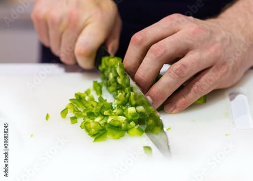 Chef cuts the vegetables cooking in a kitchen, hands slicing vegetables, preparing vegetables