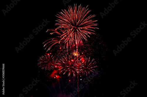 Red fireworks on black background for winter and new year festivals