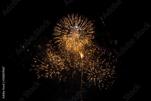 Gold fireworks on black background for winter and new year festivals